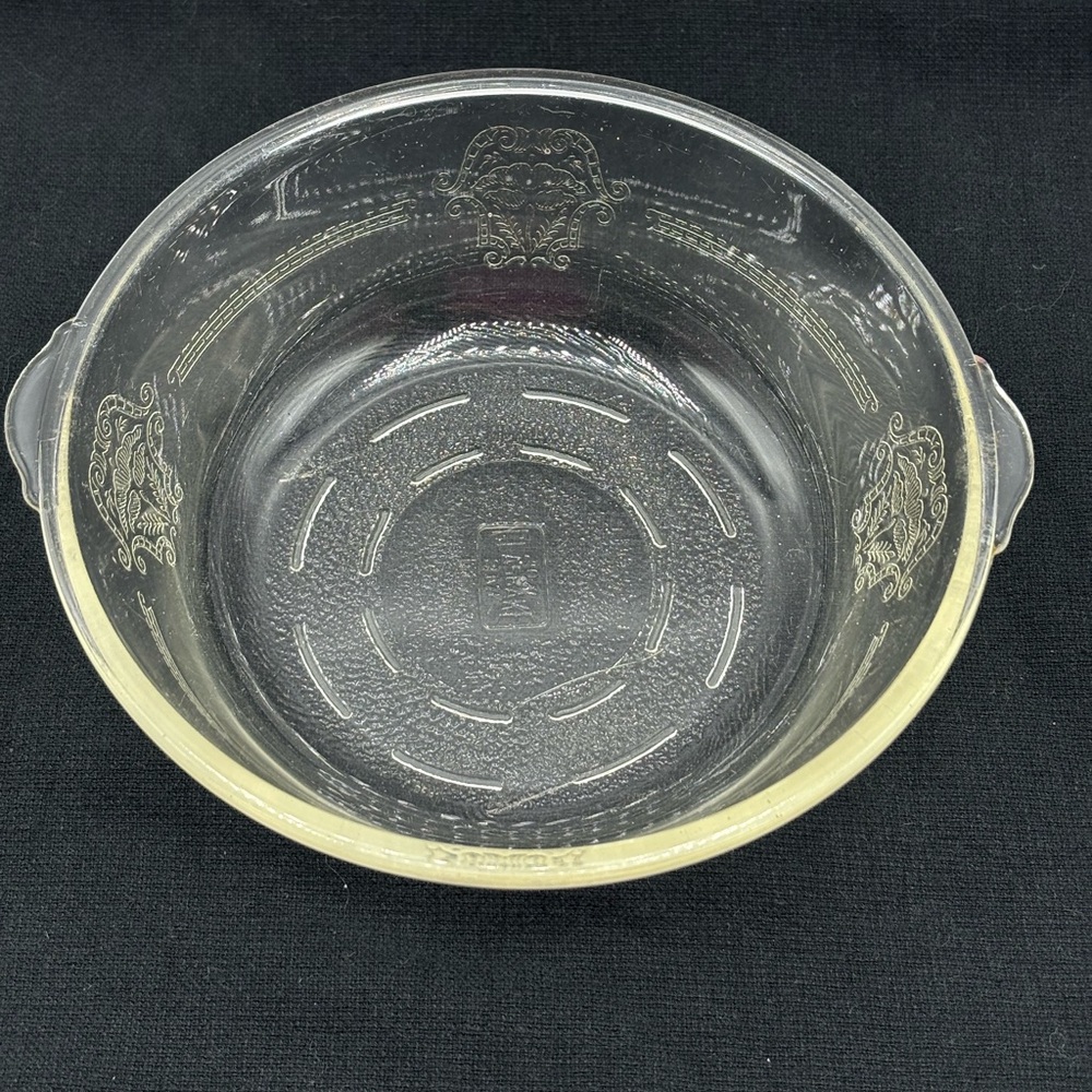 Vintage Glasbake 207 etched poppy pattern 7" round bowl. Yellow tint. No lid.